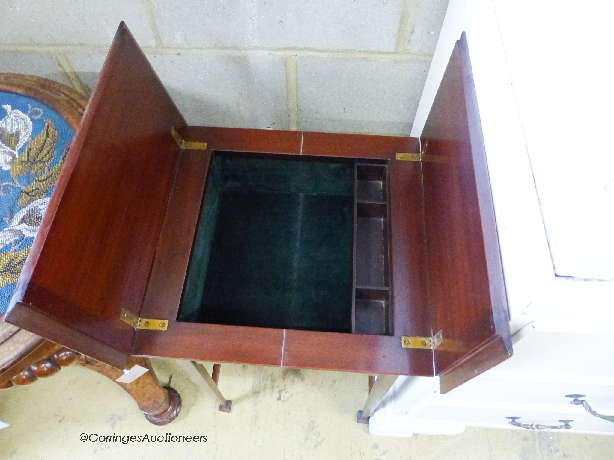 An Edwardian mahogany work table, with twin hinged flap top, W.44cm D.44cm H.69cm